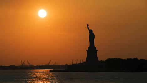 Statue of Liberty at sunset, seen from the Staten Island Ferry.