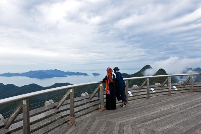 Couple standing on viewing platform at Gunung Mat Cincang.