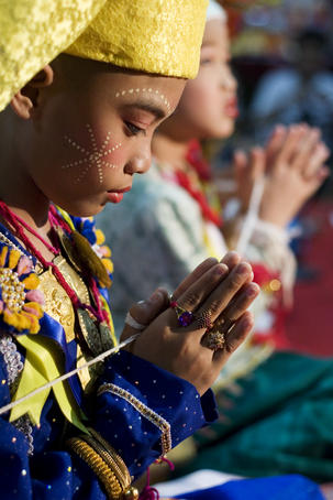 Boy praying at Wat Pa Pao temple during Poi Sang Long festival (for ordination of novice monks).