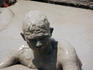 Man taking bath in mud volcano.
