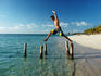 Man jumping from pillar to pillar.