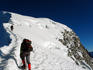Hiker and his guide ascending to the peak of Nevado Vallunaraju, Cordillera Blanca region.