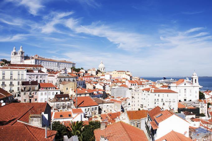 Rooftops across Alfama from the miradouro at Largo das Portas do Sol.
