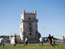 Football game between locals in park next to Torre de Bel
