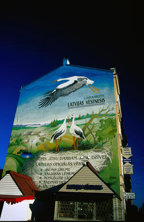 Stork mural painted on the side of a house along one of Riga's major arterials, Krisjana Barona Iela.
