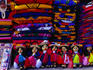 Traditional woven blankets and dolls on display at the Municipal market in San Juan Chamula - San Cristobal de Las Casas, Chiapas