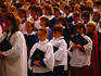 Choir singing in cloisters of Bath Abbey.