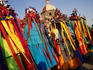 Native dancers from Tlaxcala, dressed in ribboned headwear, performing outside Basilica de Guadalupe.