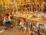 A vendor selling religious paintings and statues on the grounds of Basilica de Guadalupe.