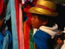 Boy from Tlaxcala on his mother's back, who's dancing in performance at the Basilica de Guadalupe.