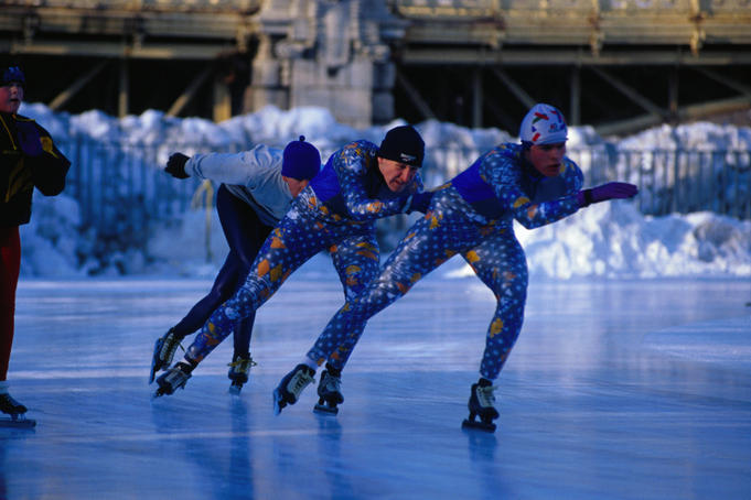 Three speed skaters warm up at City Park(named after Count Istvan Szechenyi), prior to international competition. The park is open in winter for public skating and rental boats are on offer during summer - Budapest.