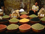 A woman selling nuts and beans at the market
