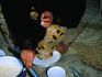 Local woman cooking a meal.