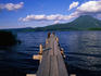 A wooden jetty stretches out onto Lake Akan, pointing towards Mt O-Akan - Hokkaido