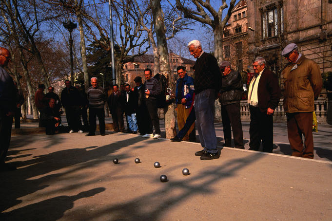 Men playing Boules in a square - Barcelona, Catalonia