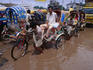 It's not easy getting a rickshaw through the streets of monsoon flooded Dhaka