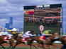 A big screen backdrops the 1999 Victoria Derby at Flemington.