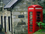 A traditional red telephone box in the Grampian Mountains - Highland, Scotland
