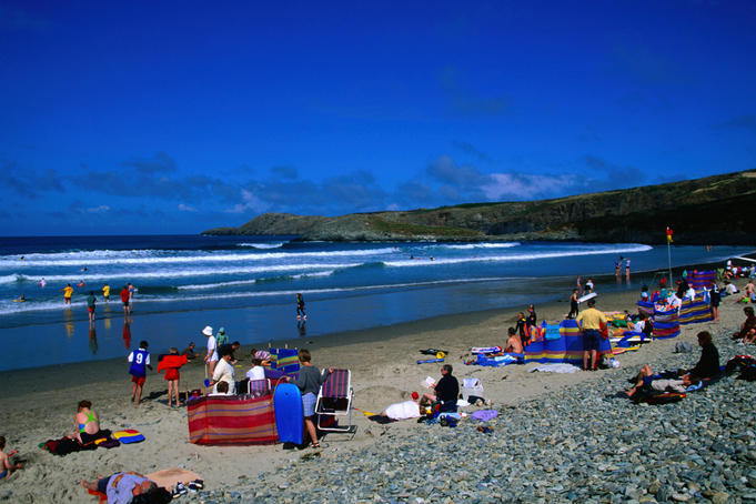 People crowd the beach on Whitesands Bay, Pembrokeshire Coast - Dyfed, Pembrokeshire, Wales