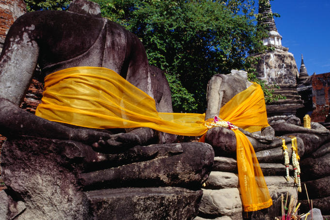 Headless Buddhas in Wat Phra Si Sanphet in the Ayuthaya Historical Park, built in the 14th century the compound once contained a 16 metre high standing Buddha covered with 250kg of gold, the Burmese arrived and he was no longer covered in gold