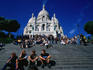 Crowds sitting on the steps in front of Basilique du Sacre Coer, Montmartre - Paris, Ile-de-France