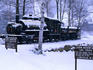 The Loon Mountain Railway: a parked train engine covered in snow