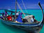 Traditional boat with crew, Ari Beach.