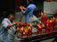 Worshippers lighting large red candles at the Luohan Si Temple.