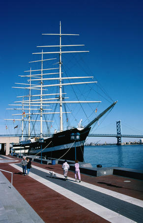 Walking past the large sailing ship docked at the wharf on the Savannah River