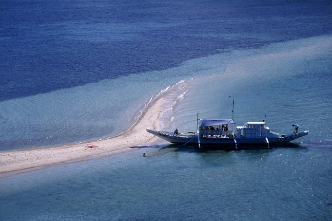 A narrow sand spit on Snick Island is a popular place to stop for a swim, El Nido