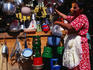 Vendor selling pots and pans at a street market