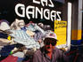 Vendor sitting at his stall at a street market