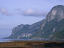 Family in the foreground dwarfed by Cadlao island in the background.