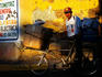 Man with bicycle in the late afternoon sun.