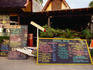 Chalkboard menus outside restaurants.