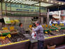 A shopper at a stall in the seafood market