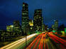 The lights from cars on Interstate 5, stream into downtown Seattle at night