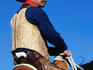 A cowboy riding a horse in the Tucson Rodeo Parade