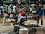 Women gathering drinking water from a well in the market place