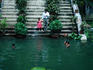 Children swimming in pond in Baldha Gardens, Wari.