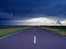 Arnhem Highway road during wet season with horizon in distance.