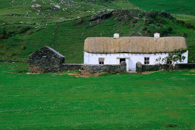 A traditional farmhouse with thatched roof in Glencolumbcille, County Donegal