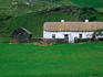 A traditional farmhouse with thatched roof in Glencolumbcille, County Donegal