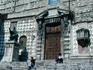 People sitting on the steps at the imposing entrance to the Duomo in Perugia