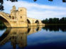 The 900 metre long wooden Pont Saint Benezet ( Le Pont d' Avignon ) was built between 1177 and 1185 to link Avignon with the settlement across the Rhone River that later became Villeneuve-les-Avignon