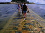Crossing causeway to St Michael's Mount with tide rolling in.