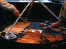 Sausages being cooked on a large grill at a stall at the Flohmarkt Sachsenhausen