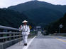 A traditionally dressed Henro pilgrim walking the 88 Temple Circuit in Tokushima-ken