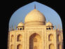 The Taj Mahal framed by an arch of the building built to provide symmetry with the mosque in the Taj Mahal grounds