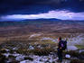 A hiker looks out from the Miner's Track, Muckish Mountain (670m), County Donegal
